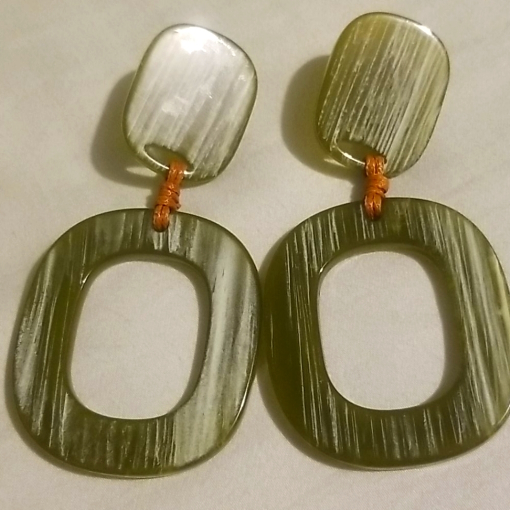Green earrings with brown ties